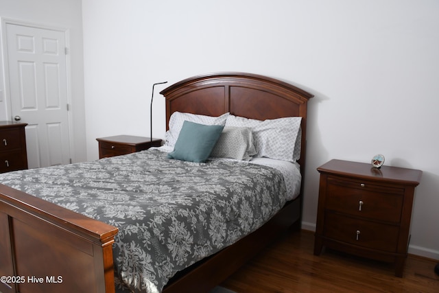 bedroom featuring dark hardwood / wood-style floors