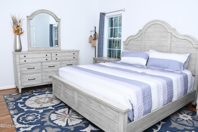 bedroom featuring dark hardwood / wood-style floors