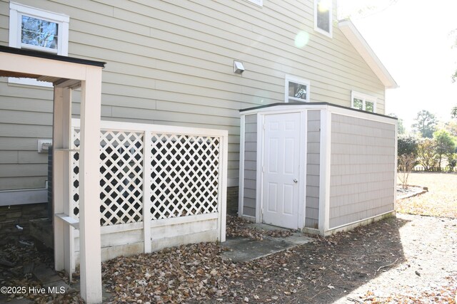 rear view of property featuring a yard and a sunroom