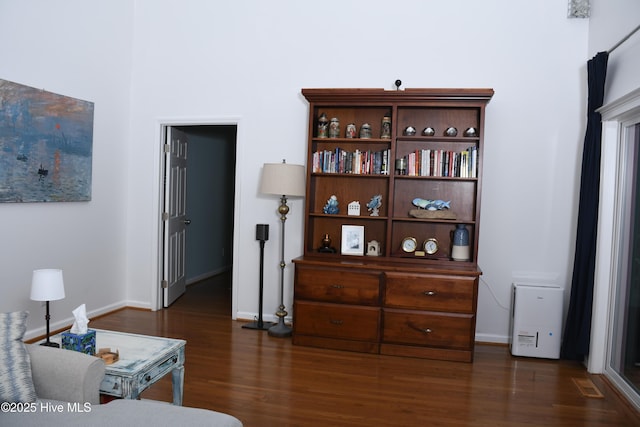 living room with dark hardwood / wood-style floors