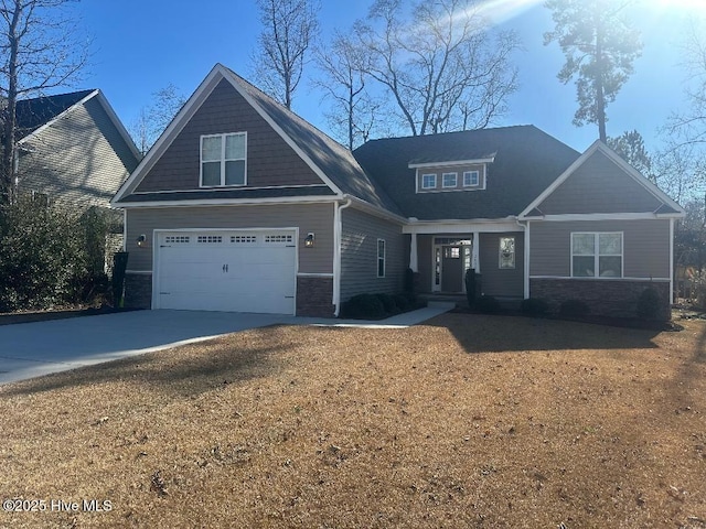 craftsman inspired home with a front lawn and a garage