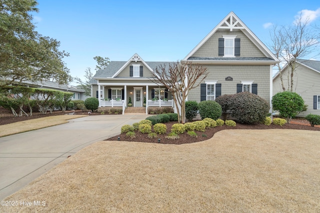 view of front of home featuring a porch and driveway