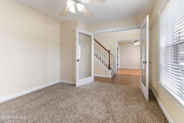 interior space featuring ceiling fan and french doors