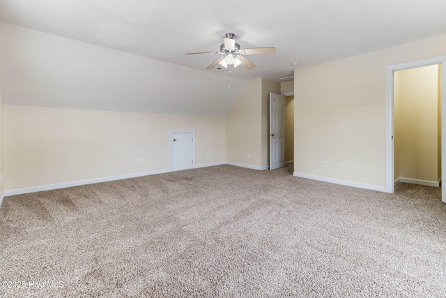 bonus room featuring lofted ceiling, carpet floors, and ceiling fan