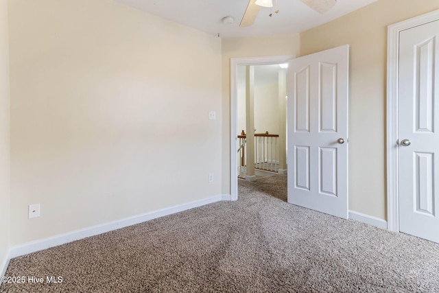 unfurnished bedroom featuring ceiling fan and carpet floors