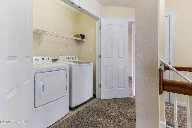 laundry area featuring independent washer and dryer and light colored carpet