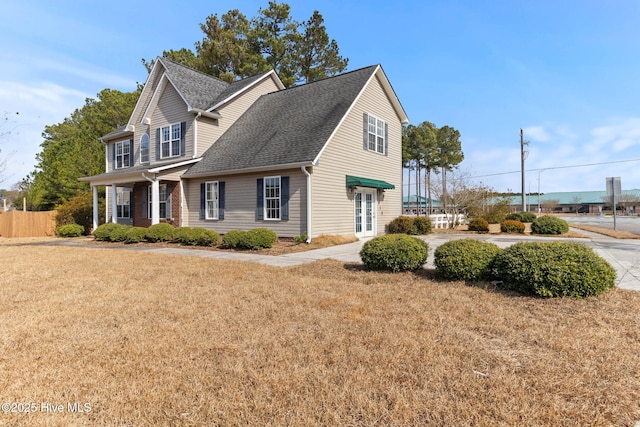 view of property exterior with a yard