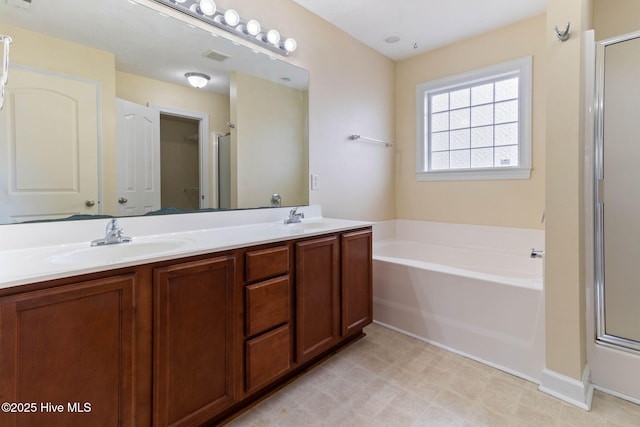 bathroom featuring vanity and separate shower and tub