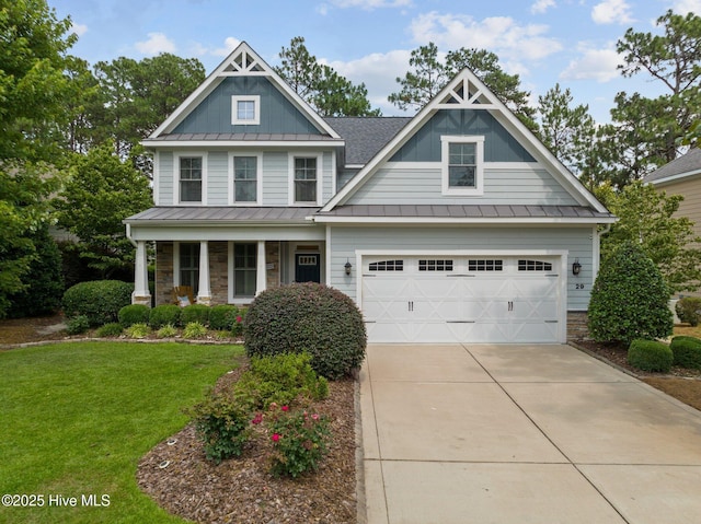 craftsman-style house featuring a garage and a front lawn