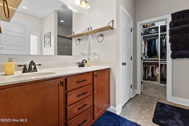 bathroom with vanity and walk in shower