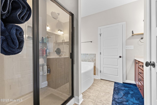 bathroom featuring tile patterned floors, vanity, and plus walk in shower