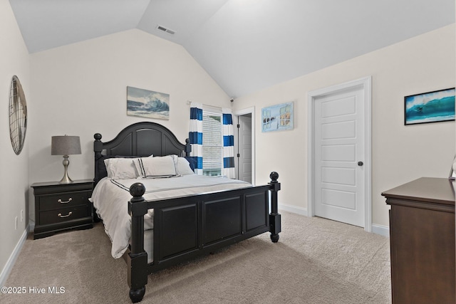 carpeted bedroom with vaulted ceiling