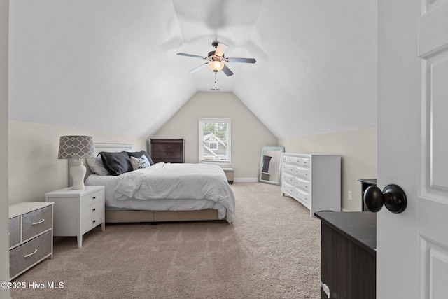 bedroom featuring ceiling fan, light carpet, and lofted ceiling