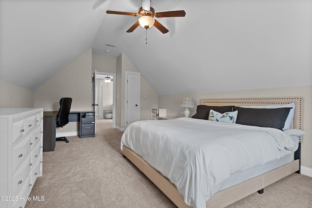 bedroom featuring ceiling fan, light colored carpet, and lofted ceiling