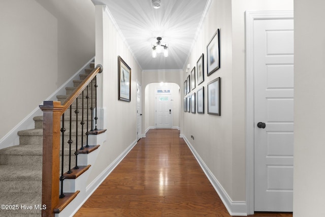 hall featuring hardwood / wood-style floors and crown molding