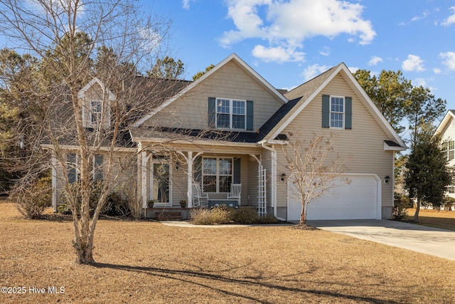 view of front of house with a garage and a porch