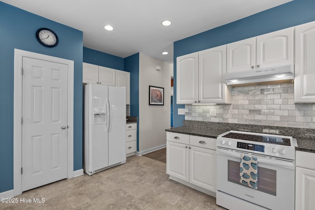 kitchen featuring dark stone countertops, white appliances, white cabinets, and tasteful backsplash