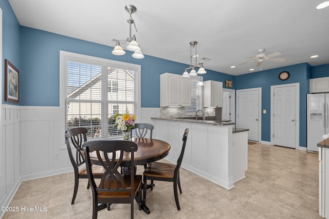 dining room featuring ceiling fan