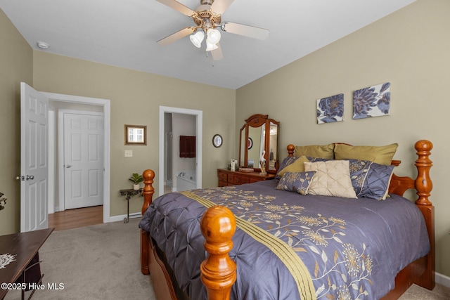 carpeted bedroom with ceiling fan and ensuite bathroom