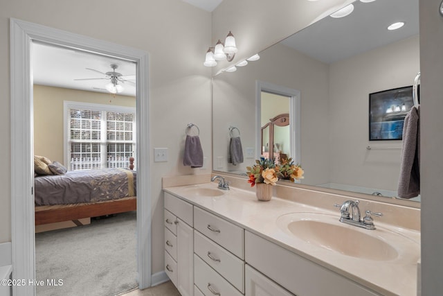 bathroom with ceiling fan and vanity