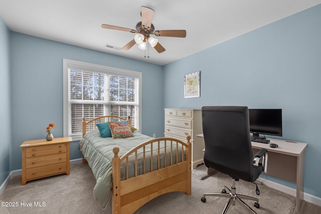 bedroom with ceiling fan and light colored carpet