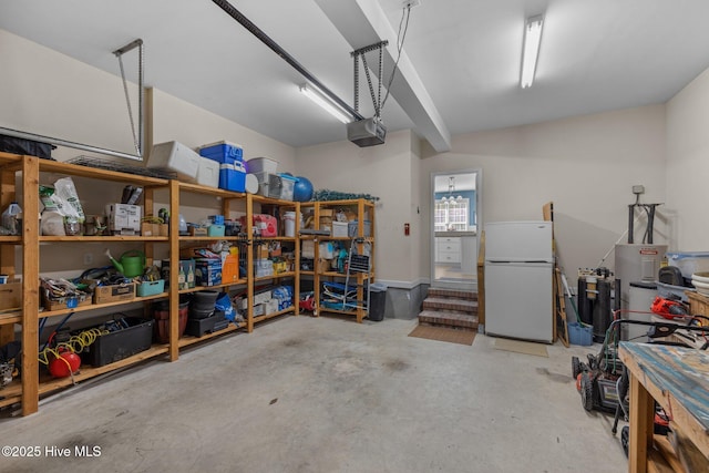 garage with white fridge and a garage door opener