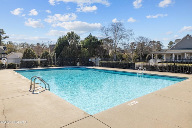 view of swimming pool with a patio