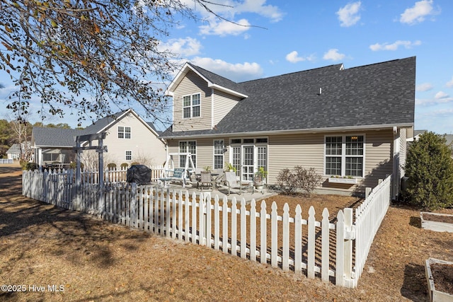 back of property with a patio