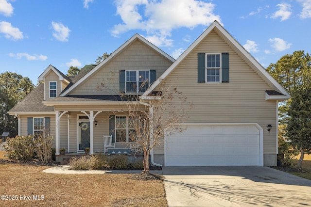 view of property featuring a garage and a porch