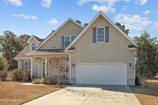 view of front of property with a garage and covered porch