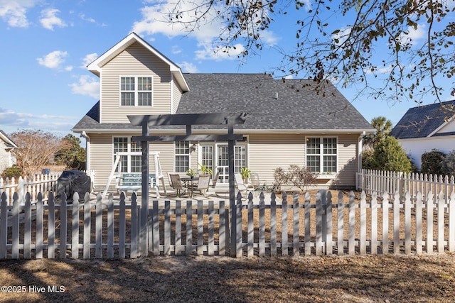 back of property with a pergola