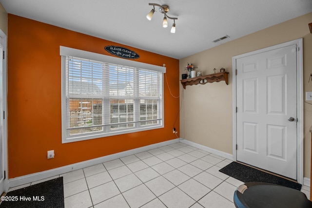 interior space with light tile patterned floors