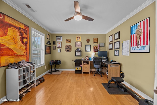 office with light hardwood / wood-style flooring, ceiling fan, and crown molding