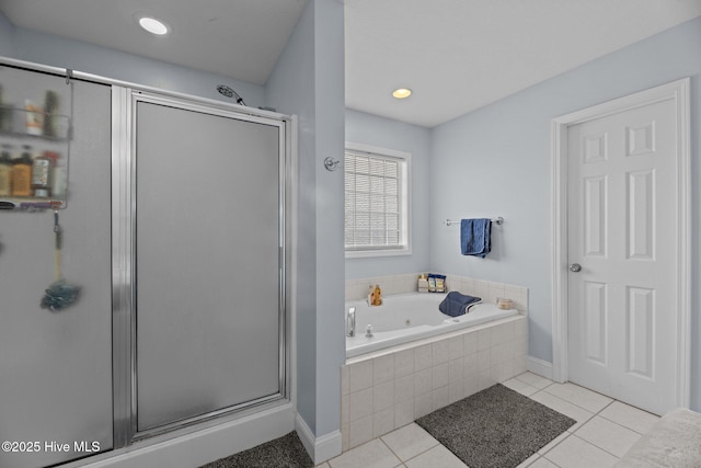 bathroom featuring tile patterned floors and separate shower and tub