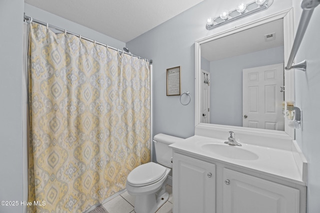 bathroom with vanity, tile patterned floors, toilet, a textured ceiling, and curtained shower