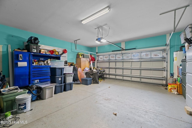 garage with gas water heater and a garage door opener