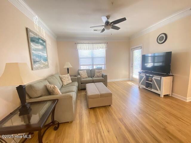 living room featuring ceiling fan, wood-type flooring, and ornamental molding