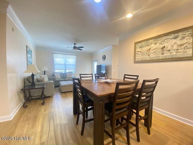 dining area with ceiling fan, light hardwood / wood-style flooring, and crown molding