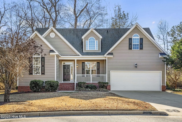 view of front of house featuring covered porch and a garage