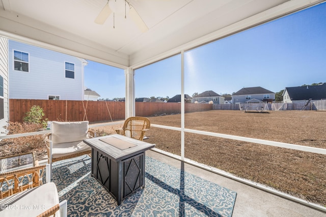 sunroom with ceiling fan