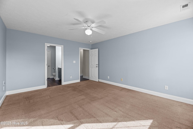 unfurnished bedroom featuring ceiling fan and carpet floors