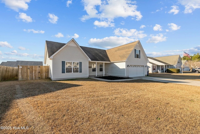 view of front of property featuring a garage and a front yard