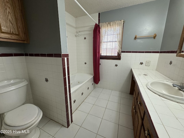 full bathroom with tile walls, tile patterned flooring, toilet, and a textured ceiling