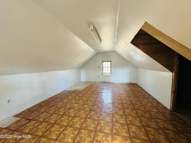 bonus room featuring lofted ceiling