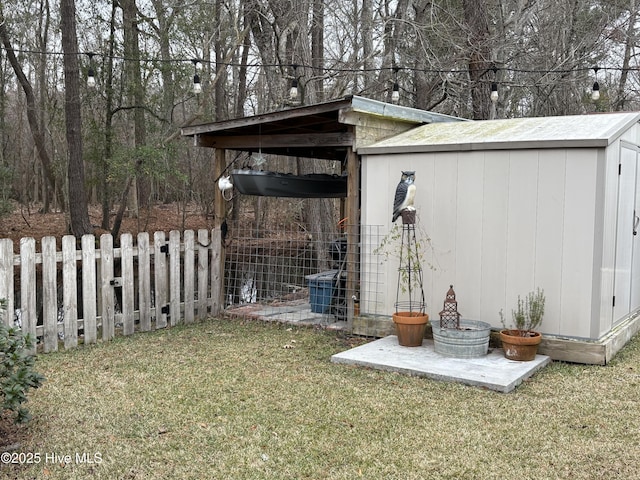 view of outdoor structure with a yard and central air condition unit