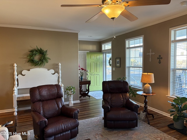 sitting room with ornamental molding, ceiling fan, and dark hardwood / wood-style floors