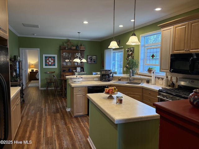 kitchen featuring black appliances, hanging light fixtures, a center island, dark wood-type flooring, and sink