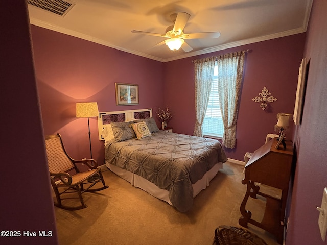 bedroom with carpet floors, ceiling fan, and crown molding