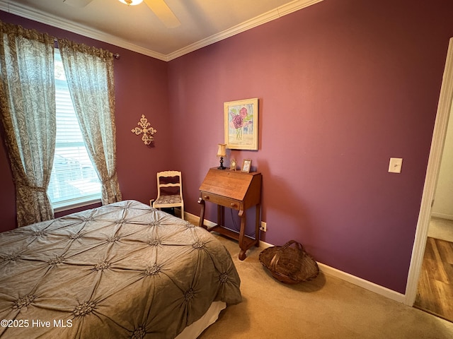 bedroom with ornamental molding, ceiling fan, and carpet