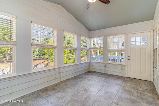 unfurnished sunroom with ceiling fan and lofted ceiling